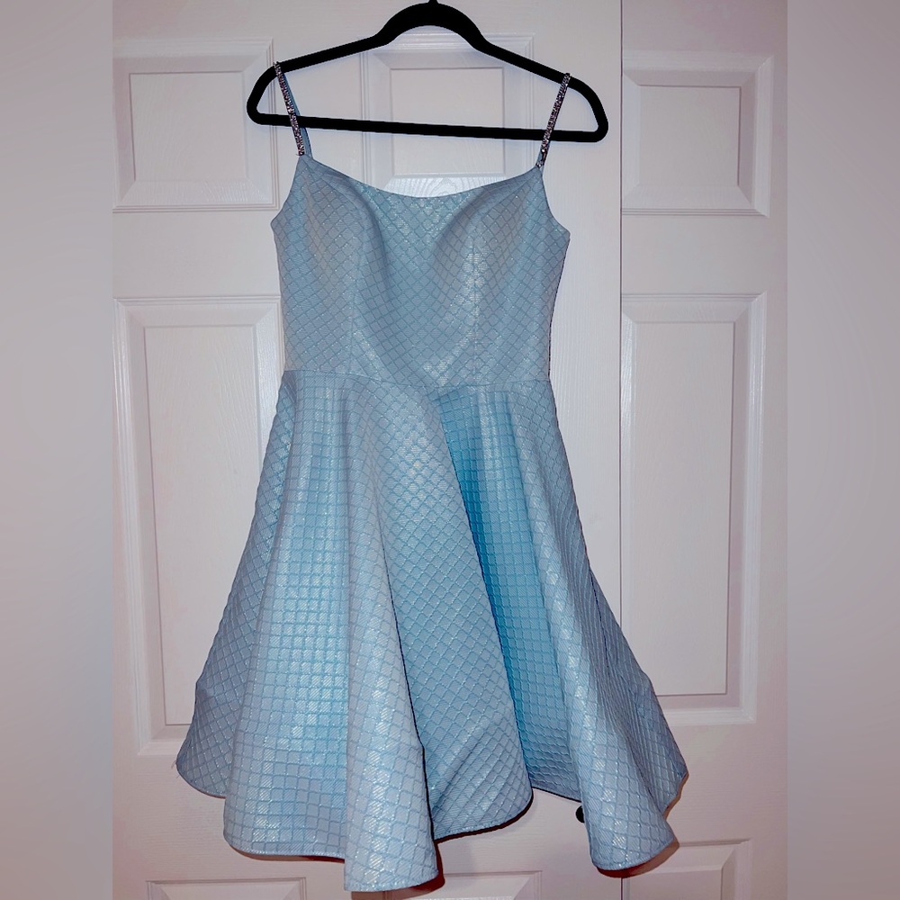 Light blue mini dress with silver embellishments. New with tags. Size Small.